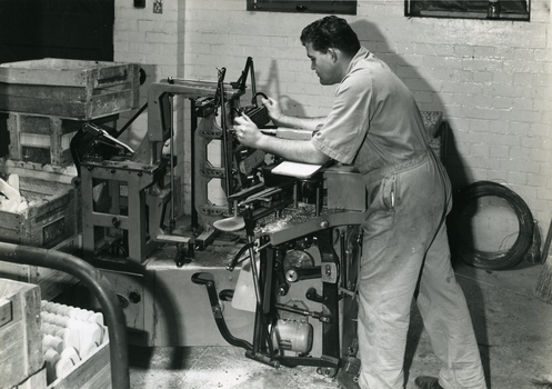 Ron Blinco working on a semi-automatic brushmaking machine.