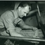 Mannix O'Reagan using a comb on a loom