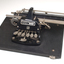 Metal Braille typewriter attached to rectangle base board