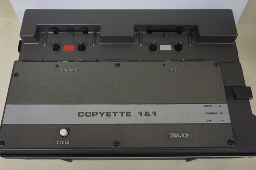 Brown cassette duplicator with spools for 'Master' and 'Original'