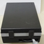 Closed black case with cord at end