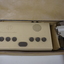 Tan rectangular box in vinyl bag