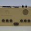 Tan rectangular box in vinyl bag