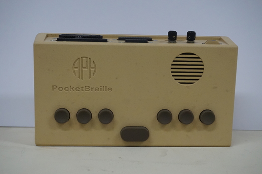 Tan rectangular box in vinyl bag