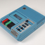 Blue plastic rectangular talking book player with buttons for navigational controls