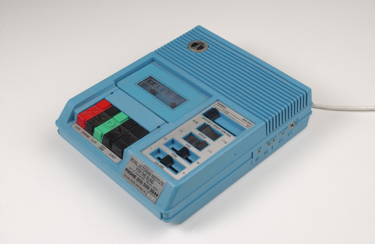 Blue plastic rectangular talking book player with buttons for navigational controls