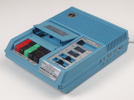 Blue plastic rectangular talking book player with buttons for navigational controls
