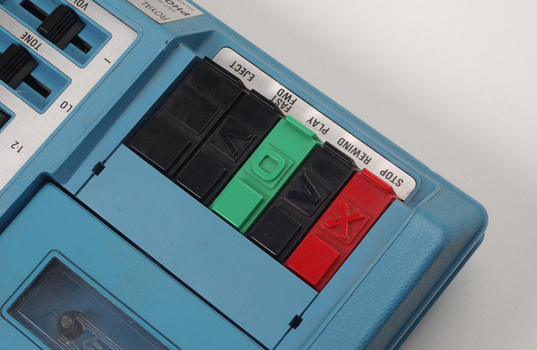 Close up of 5 buttons with tactile markers