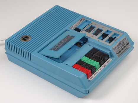 Blue plastic rectangular talking book player with buttons for navigational controls