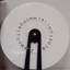 Round wheel with Braille held by a black plastic handle