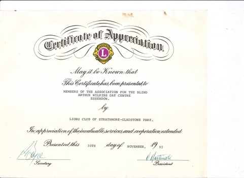 Writing with signatures and Lions Club emblem