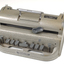 Metal Braille writer with nine grey keys, carriage return key and paper rollers on either side