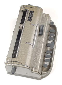 Metal Braille writer with nine grey keys, carriage return key and paper rollers on either side