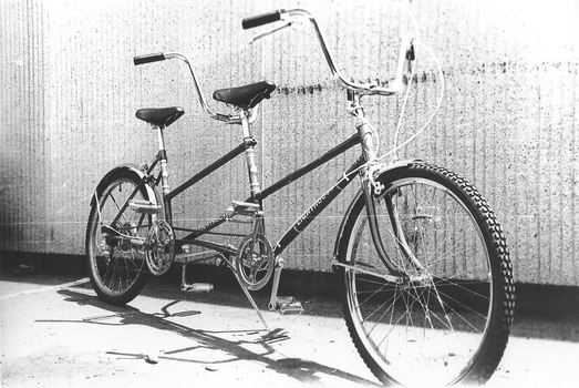 Tandem bicycle outside Mitchell cycles in carpark