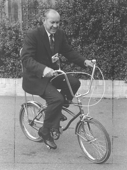 Man riding kids Mitchell cycle