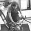 Worker assembling a bicycle on the factory floor