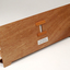 Front view of wooden board with gap in the middle showing music staff