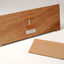 Front view of wooden board with gap in the middle showing music staff