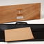 Front view of wooden board with gap in the middle showing music staff