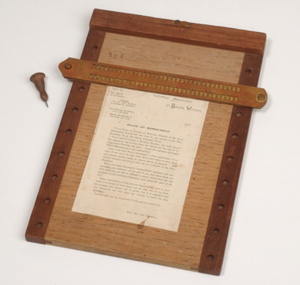 Wooden braille board with wooden header, braille stylus and removable metal braille frame