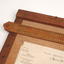 Wooden braille board with wooden header, braille stylus and removable metal braille frame