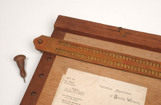 Wooden braille board with wooden header, braille stylus and removable metal braille frame