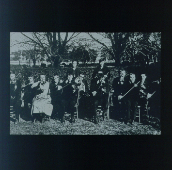 15 musicians playing in the front garden of RVIB