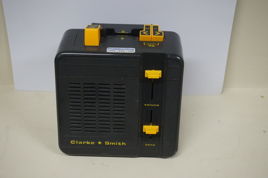 Black box with yellow buttons and dials
