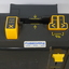 Black box with yellow buttons and dials