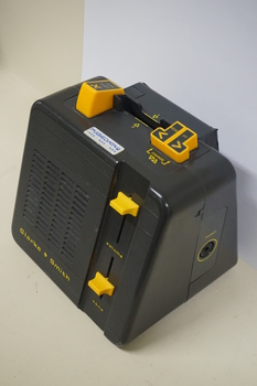Black box with yellow buttons and dials