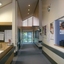 View down hallway from front area, past reception and towards centre manager office