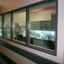 Looking through window to adaptive equipment shop and display
