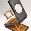 1 wooden box with fold out top and inset glass magnifier.
