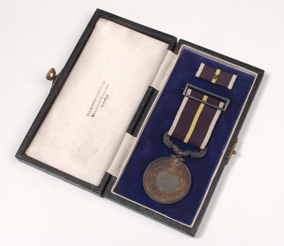 Medal on ribbon inside box