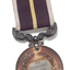 Silver medal hanging from burgundy ribbon