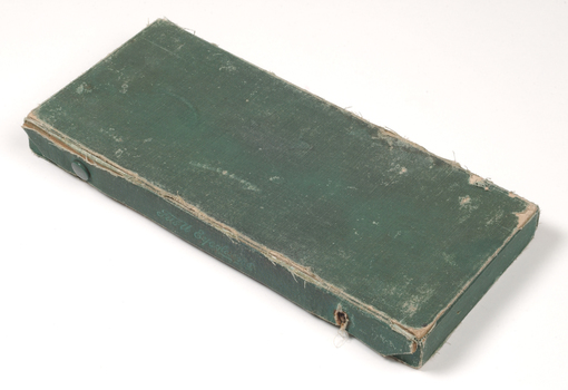 Rectangular box covered in green cloth