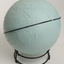 Light blue sphere with raised surfaces of various textures and braille writing