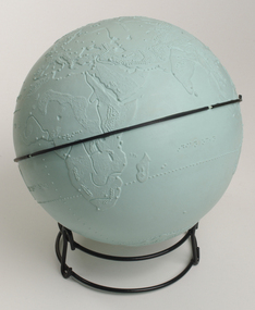 Light blue sphere with raised surfaces of various textures and braille writing