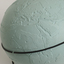 Light blue sphere with raised surfaces of various textures and braille writing