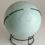 Light blue sphere with raised surfaces of various textures and braille writing