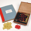 Braille book and wooden box containing yellow and red rubber markers