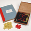 Braille book and wooden box containing yellow and red rubber markers