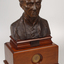 Bronze bust of Louis Braille on wooden mount