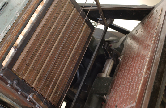 Braille plates attached to the steel and cast iron printing press