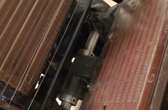 Braille plates attached to the steel and cast iron printing press