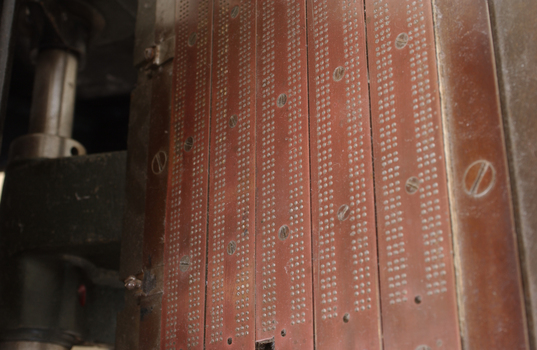 Braille plates attached to the steel and cast iron printing press