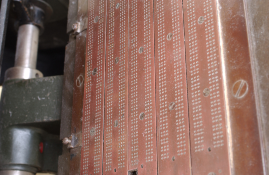 Braille plates attached to the steel and cast iron printing press