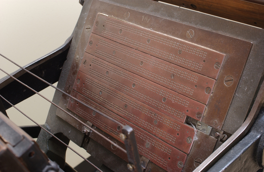 Braille plates attached to the steel and cast iron printing press