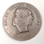 Silver coin with profile of short-haired woman turned to the left