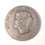 Silver coin with profile of short-haired woman turned to the left